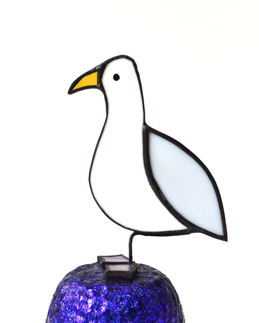 Stained glass seagull with a solar light on a white background